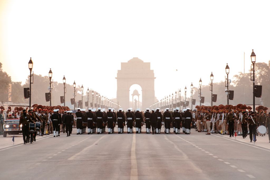 A grand military parade in front of the iconic India Gate in New Delhi, India.