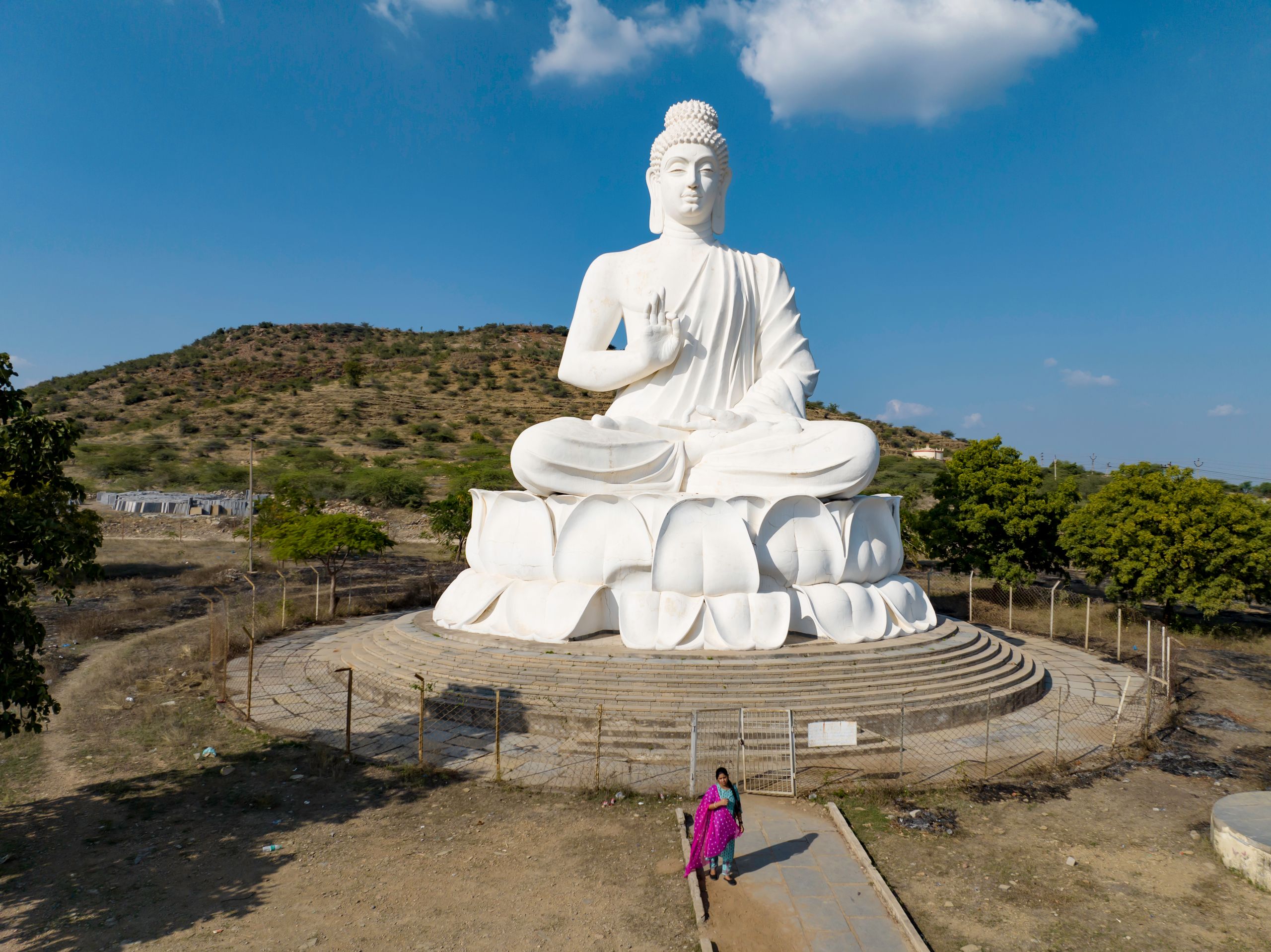 A stunning aerial view of a large white Buddha statue in Andhra Pradesh, India.